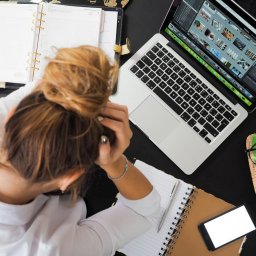 tired woman working at office desk