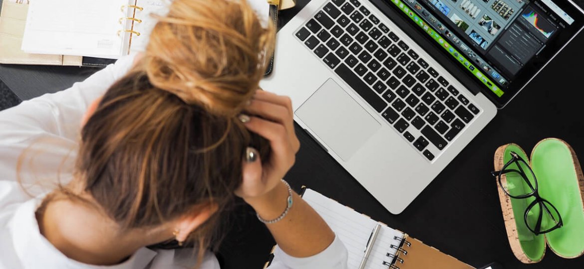 tired woman working at office desk