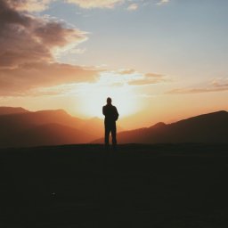 man looking at sunset